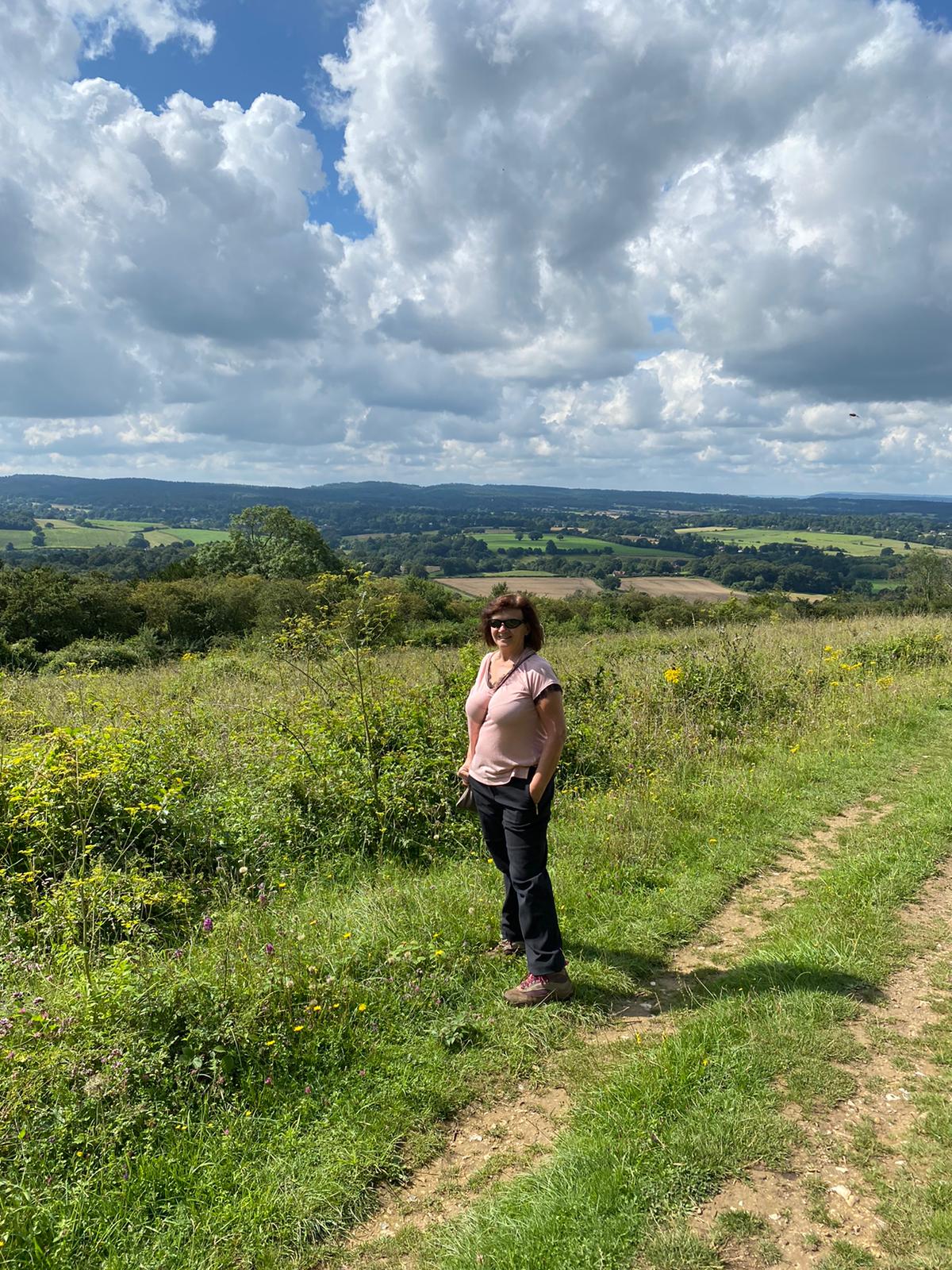 Paula Moss standing in the Surrey countryside